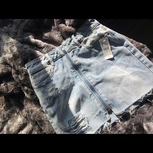 Blue zip up distressed denim skirt